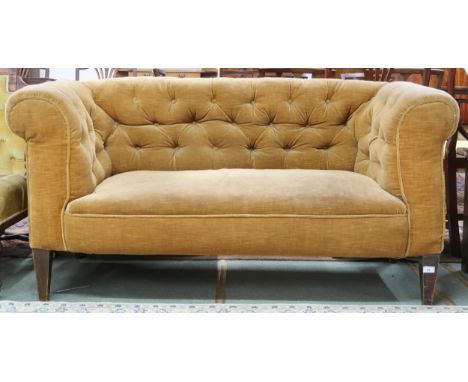 A Victorian button back upholstered club style two seater settee on square tapering supports, 72cm high x 152cm wide x 73cm d