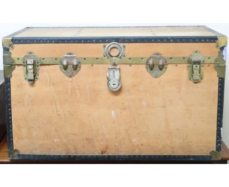 A 20th century metal bound wood panel travel trunk, 53cm high x 91cm wide x 52cm deep Condition Report:Available upon request