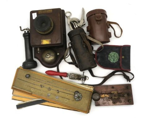 A mixed lot, comprising a Welsh brass tobacco tin by Morgan and Manley of Aberdare, horsehair barber's brush, handheld emboss