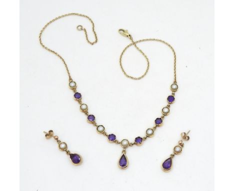 A 9ct gold amethyst and pearl necklace and earring set. Length of the necklace 44cm, length of earring drop 2.5cm, weight tog