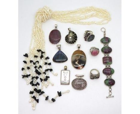 A rare rock crystal with red hematite inclusions, in a silver pendant mount, together with a matrix opal ring set with star r