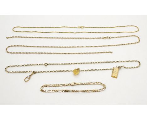 A 9ct chain hung with three pendants, a gem set wishbone, dice and ingot, together with a 9ct figaro chain bracelet and two 9