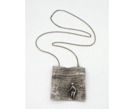 A large Modernist silver pendant titled 'The Carpet Seller', made in Finland by Jorma Laine signed and dated 1970, 5.8cm x 5.