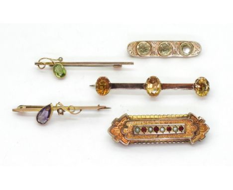 Three 9ct gold vintage brooches set with peridot, citrine and amethyst weight 8gms, together with a&nbsp;two further gem set 