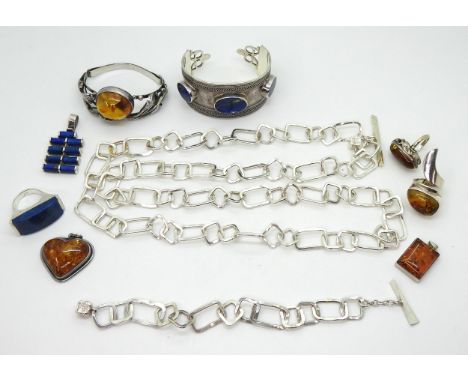 A silver lapis lazuli cuff bangle, pendant and ring, an amber bangle, tow rings and two pendants, together with a silver Hami