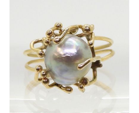 A retro yellow metal and pearl ring, size M, weight 3.1gms Condition Report:Available upon request