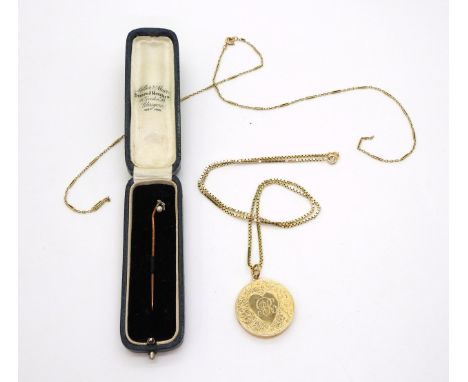 A 15ct gold circular locket with all over floral and heart engraving, hallmarked Birmingham 1918, diameter 2.8cm, and a broke