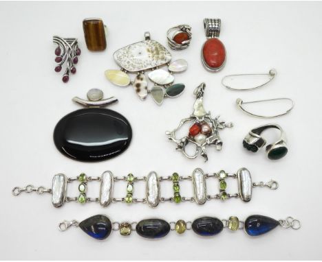 A collection of statement gem set silver and white metal jewellery some signed to include, a malachite ring, a ruby ring, cor