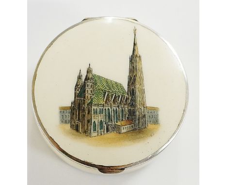 A Continental silver and enamel rouge box, the hinged top printed with a continental cathedral on an ivory enamel ground, 4.3