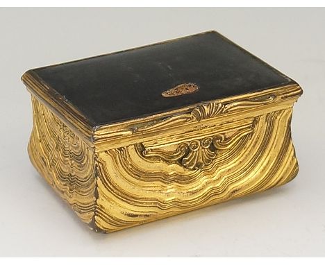 An 18th Century ormolu and tortoiseshell snuff box, the rectangular tortoiseshell lid above an ogée body with shell and scrol