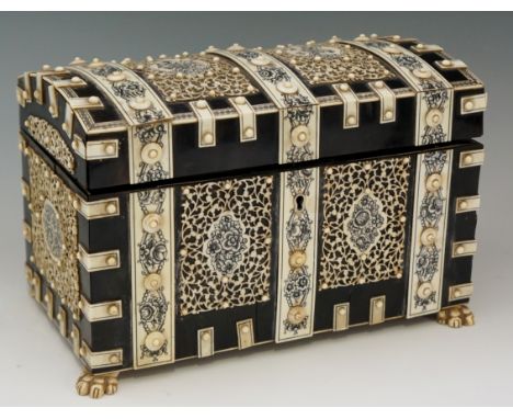 An early 19th Century Vizagapatam ivory mounted ebonised dome topped tea caddy, the top, front, sides and back all with finel