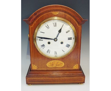 An Edwardian mahogany mantel clock in George III style with domed cavetto moulded top, the front string inlaid, shaded shell 