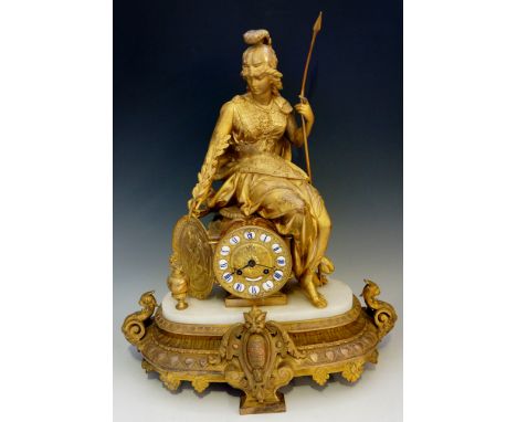 A French ormolu and marble mantel clock, the movement contained within a circular fronted waisted square pedestal, a seated f