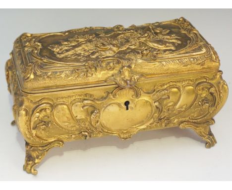 A Continental ormolu casket, the hinged cover with a cast panel of reclining female with winged amorini within flowerhead, C 