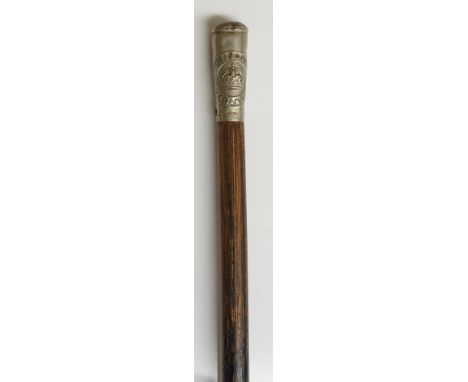 An ebonised swagger stick, the white metal terminal inscribed Prisons Tanganyika, 70cm long 