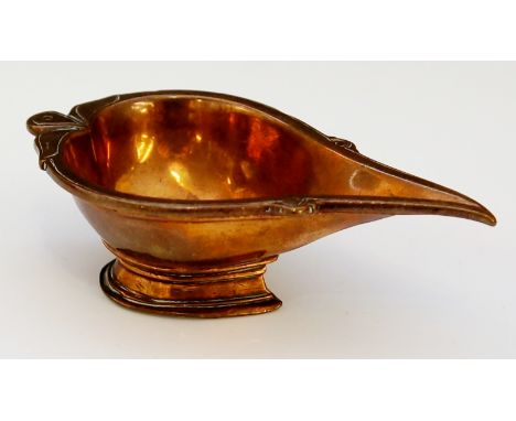 A Roman? copper oil lamp of tear shape with engraved border on spreading conforming foot, 9.5cm wide
