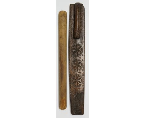 An 18th Century Scandinavian spruce wash bat with carved handle, the bat carved four rosettes and dated 1759, initialled with