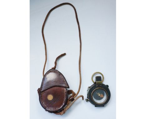 A WWI military compass by Sampson Mordan & Co, numbered 62009, dated 1917, contained within a brown leather case stamped Fren