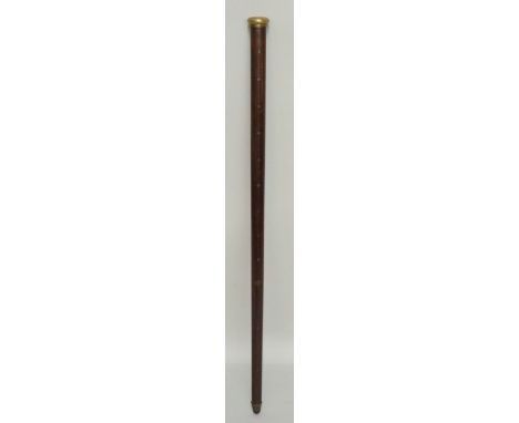 An unusual Chinese hardwood measuring stick, the top with compressed engine turned brass pommel the shaft inlaid in steel wir