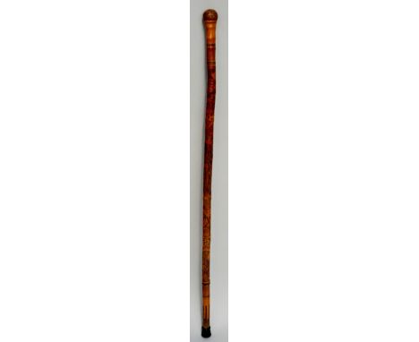 A Japanese bamboo walking stick, rootball terminal, the shaft heavily carved with Samurai, mountains and geometric shapes, br