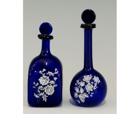 Two unusual miniature 'Bristol' blue glass scent bottles, both with white enamel wild flower decoration, each lid with small 