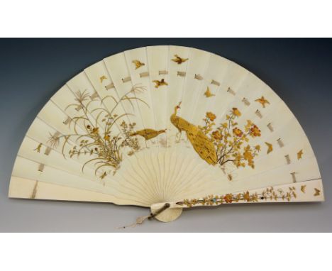 A fine Japanese ivory fan, the guards decorated in abalone, red coral and gilt with flowers, leafage and insects, the segment