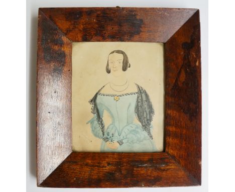 Early 19th Century portrait miniature, half length of a young woman wearing blue dress and black shawl, a yellow flower at he