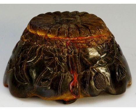 A Chinese horn scroll weight, the top fluted with square tablet, incised text, the sides carved with lotus blossoms, leafage,