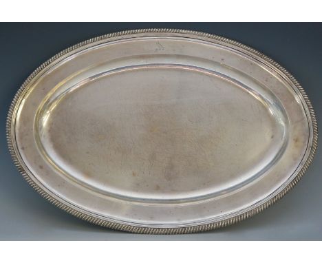 Paul Storr (1770-1844) - a pair of large silver dishes, oval bodies with gadrooned rims, both engraved with crest belonging t