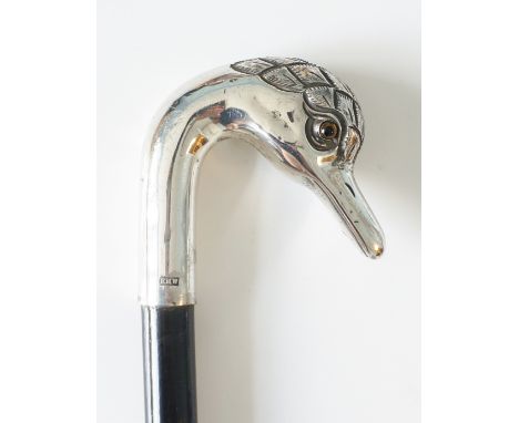 An Edwardian engraved silver swan's head walking stick, inset glass eyes, by Edwin Henry Watts, London 1908, ebonised shaft. 