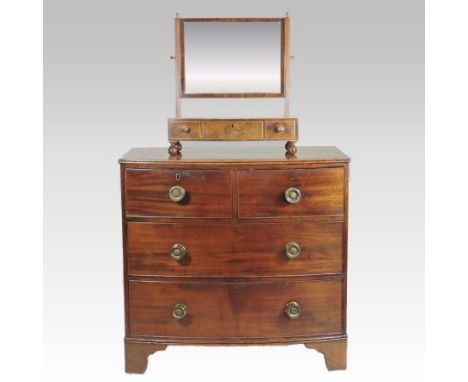 A 19th century mahogany and boxwood strung bow front chest, of small proportions, containing two short over two long drawers,