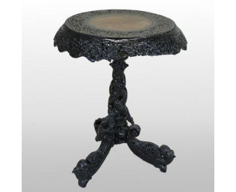 A 19th century Burmese carved and later painted occasional table, on a tripod base, 57cm