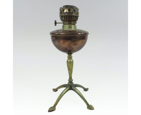 An Arts and Crafts brass and copper oil lamp base, by W. A. S. Benson, having a copper reservoir, on a turned brass stem and 