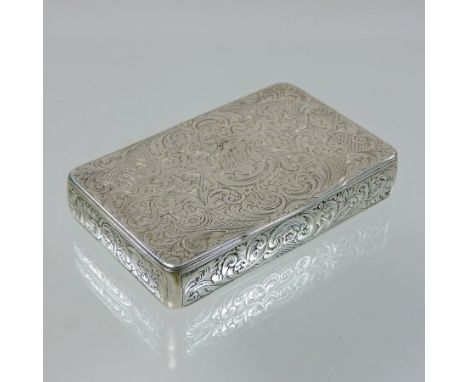 A 19th century Russian silver snuff box, of hinged rectangular shape, with all over scrolled decoration and gilt interior, in