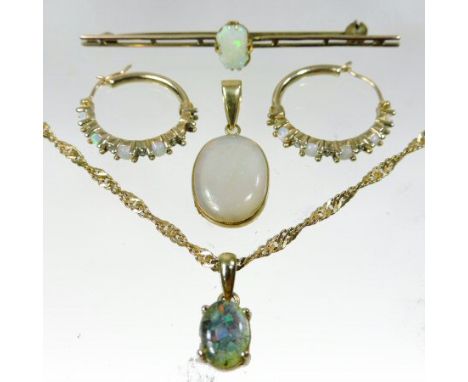 An early 20th century unmarked opal bar brooch, 6cm wide, together with a pair of opal and diamond hoop earrings, an opal pen