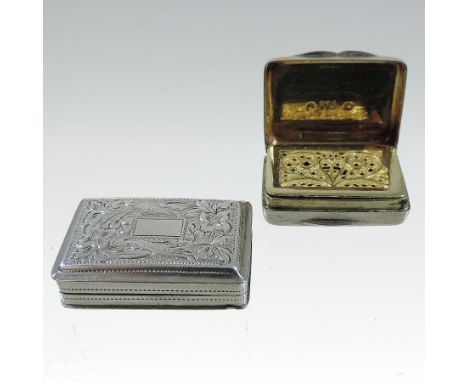 A William IV silver vinaigrette, of hinged rectangular shape, with engine turned decoration and a gilt interior, by Thomas Sh