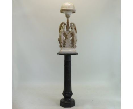 An early 20th century carved alabaster figural lamp, on a marble column base,  204cm high
