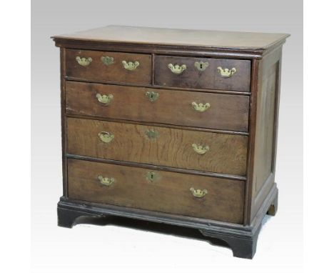 An 18th century oak chest, containing two short over three long drawers, on bracket feet,  each drawer lined with Charles II 
