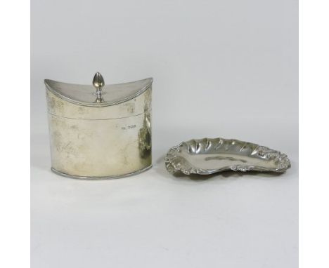 An early 20th century silver tea caddy, of navette shape, with a hinged lid, Sheffield 1919, 9cm high, together with a Victor