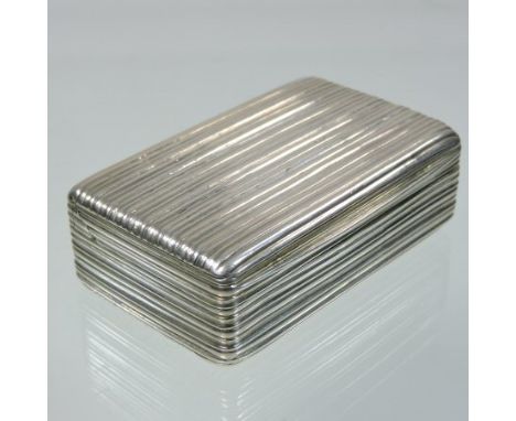 A George III silver snuff box, of hinged rectangular shape, with reeded decoration, the gilt interior engraved with an eagle,