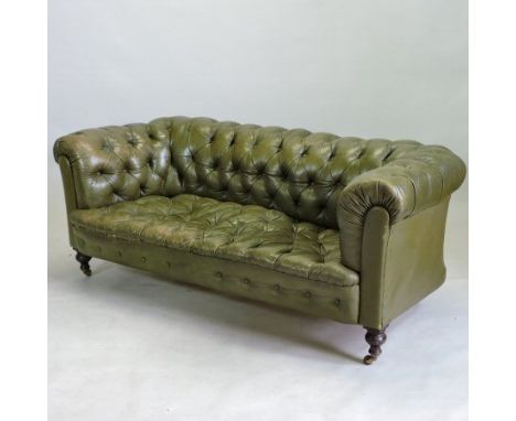 A Victorian green leather upholstered button back Chesterfield sofa, on turned legs and castors, 180cm