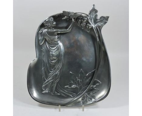 A WMF style Art Nouveau pewter figural plaque, relief decorated with a stylised lady holding a bird, numbered 335 to the reve