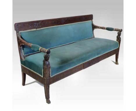 A Louis XVI and later French parcel gilt, carved and painted mahogany sofa, upholstered in blue, with herm supports, 190cm