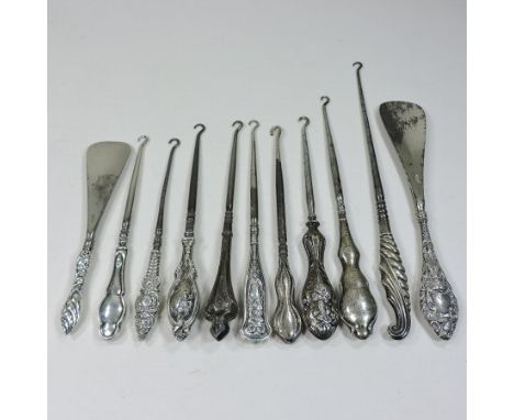 A collection of eleven mainly 19th century silver handles button hooks and shoe horns, various makers and dates (11)