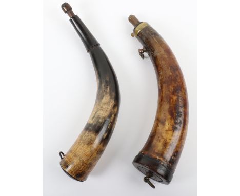 Two Cow Horn Powder Horns, the first with wooden end plug stamped ARNOLD &amp; SONS LONDON, body stamped FCMT(?) common brass