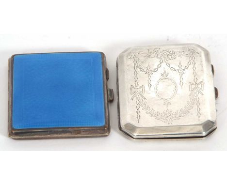 A George V silver cigarette case of rectangular form with cantered edges, chased and engraved all over with ribbons and garla