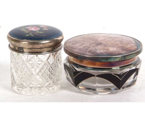 Mixed Lot: An Art Deco and silver lidded dressing table jar, the cut glass jar with black decorated mounted shoulders, the pu