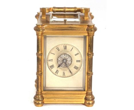 John Bennett, London brass cased repeating carriage clock with silvered dial with Roman numerals, central floral boss to a br