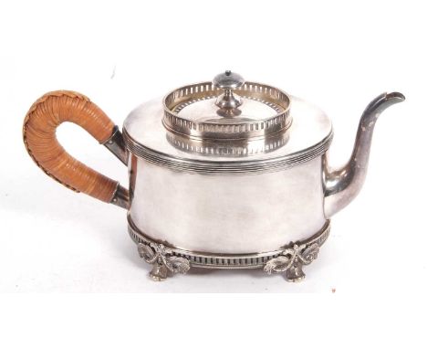 A vintage silver plated Scandinavian teapot of oval form having a gallery rim, swan neck spout and cane decorated handle, sup