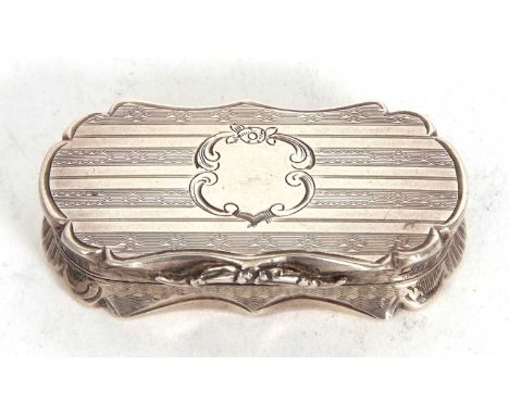 A Victorian silver vinegrette of shaped rectanglar form, engine banded decorated around a vacant cartouche, the hinged lid op